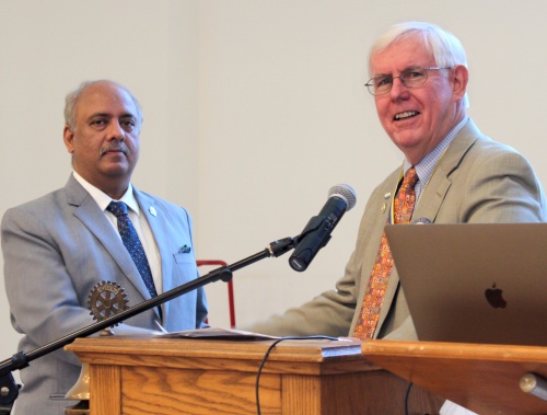 Rotary International President Shekhar Mehta accepts a check for $5,000 to The Rotary Foundation's Polio Plus fund from Wilmington Rotary Club President Cleve Callison. Mehta visited the club on Jan. 11, 2022. 