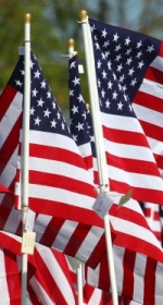 Each flag is tagged with the name of person honored